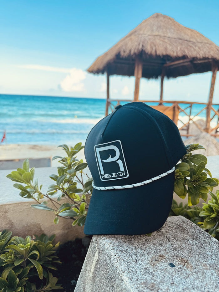 Reeled In rope hat with turquoise Keys water behind it